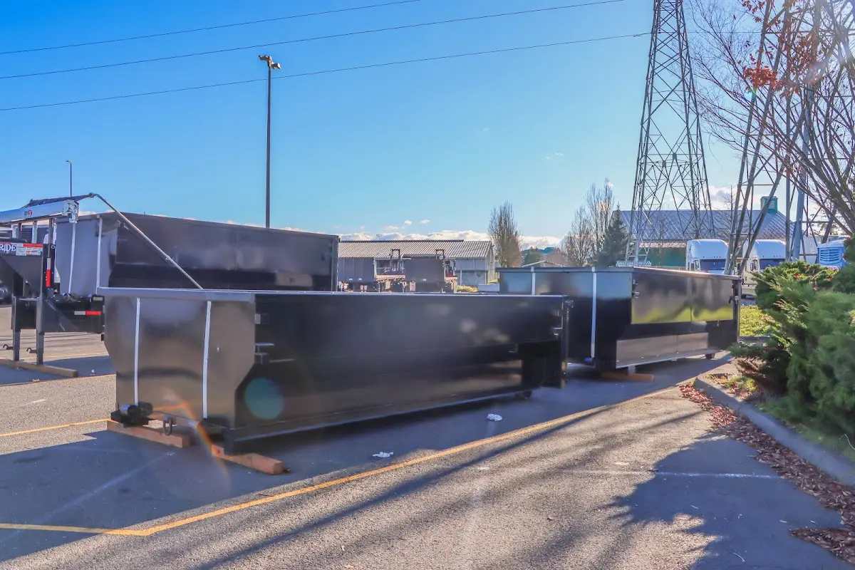 Roll-off dumpster ready for waste disposal at job site for 15 Yard Dumpster Rental in Covington